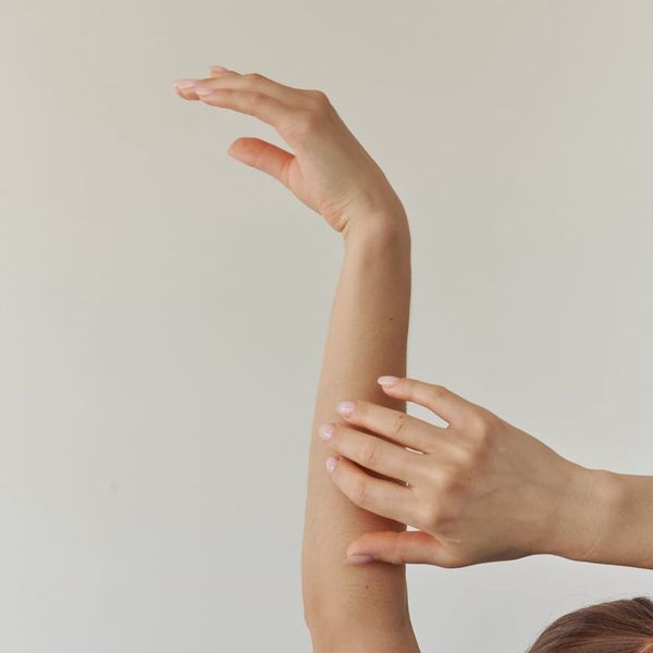 Woman in a serene yoga pose, embodying fluid movement and balance.